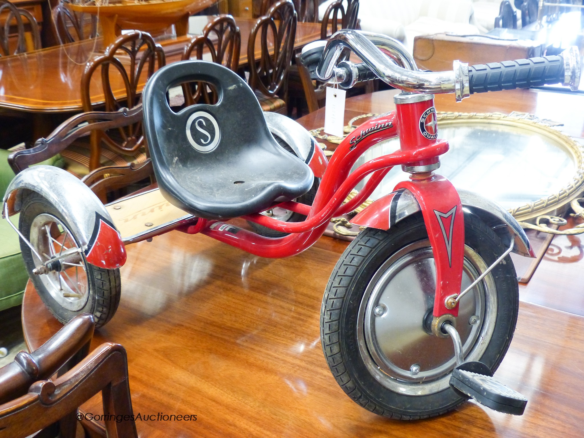 A child's Schwim tricycle.